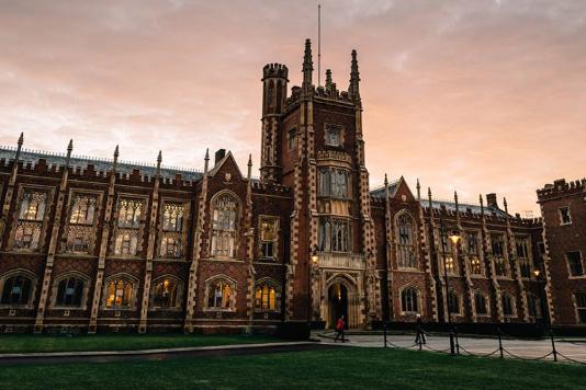 Side angle of front of Lanyon building of QUB at dusk